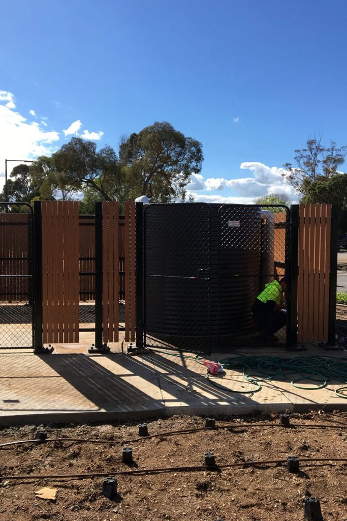 Enclosing water tank fencing solution Melbourne